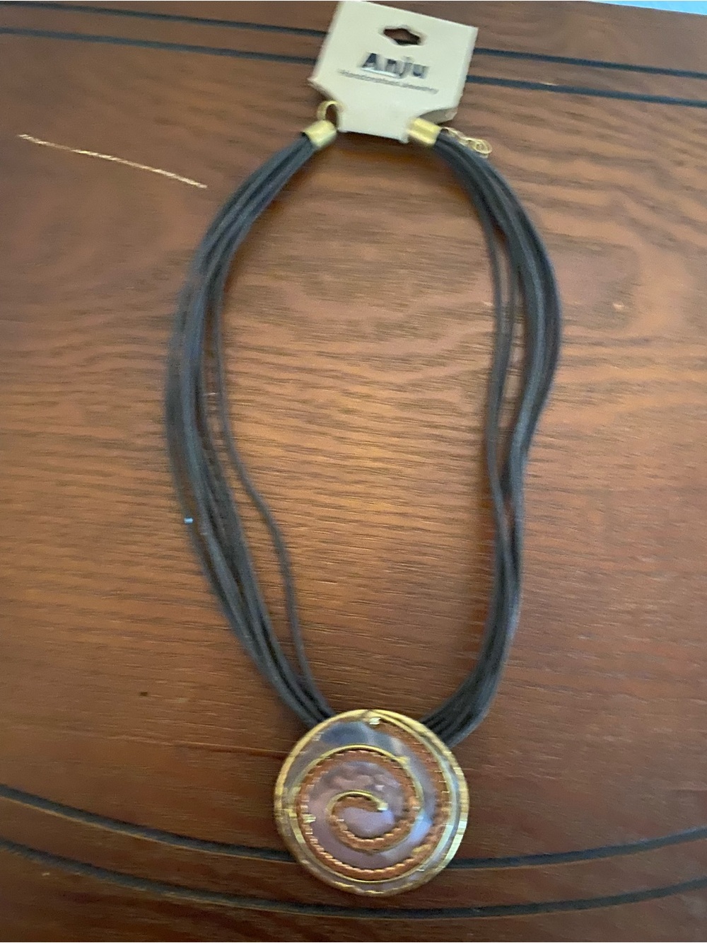 Multi-Strand Brown Necklace with Swirl Pendant